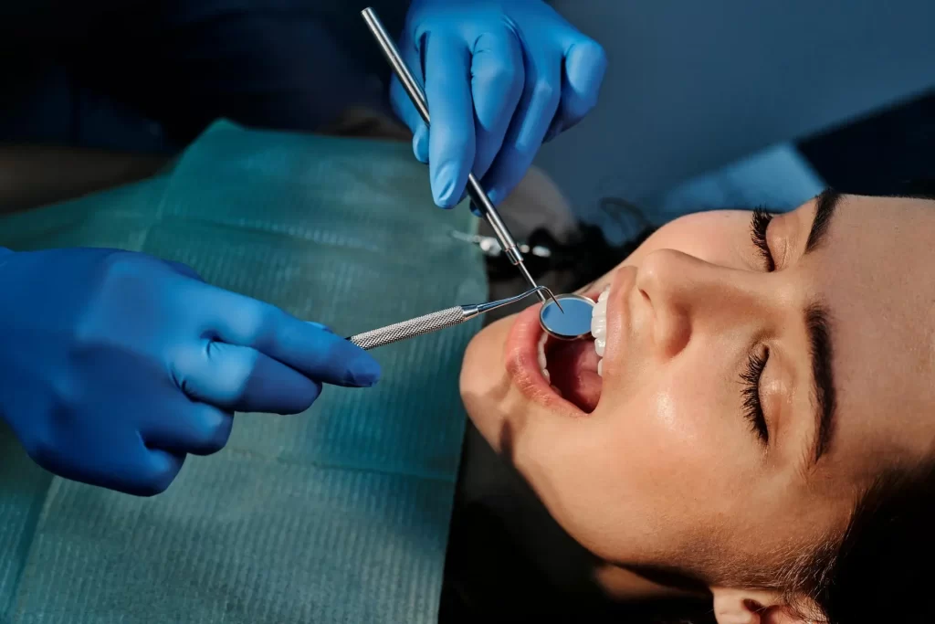patient at the dentist during a check-up related to wisdom tooth removal aftermath patient at the dentist during a check-up related to wisdom tooth removal aftermath